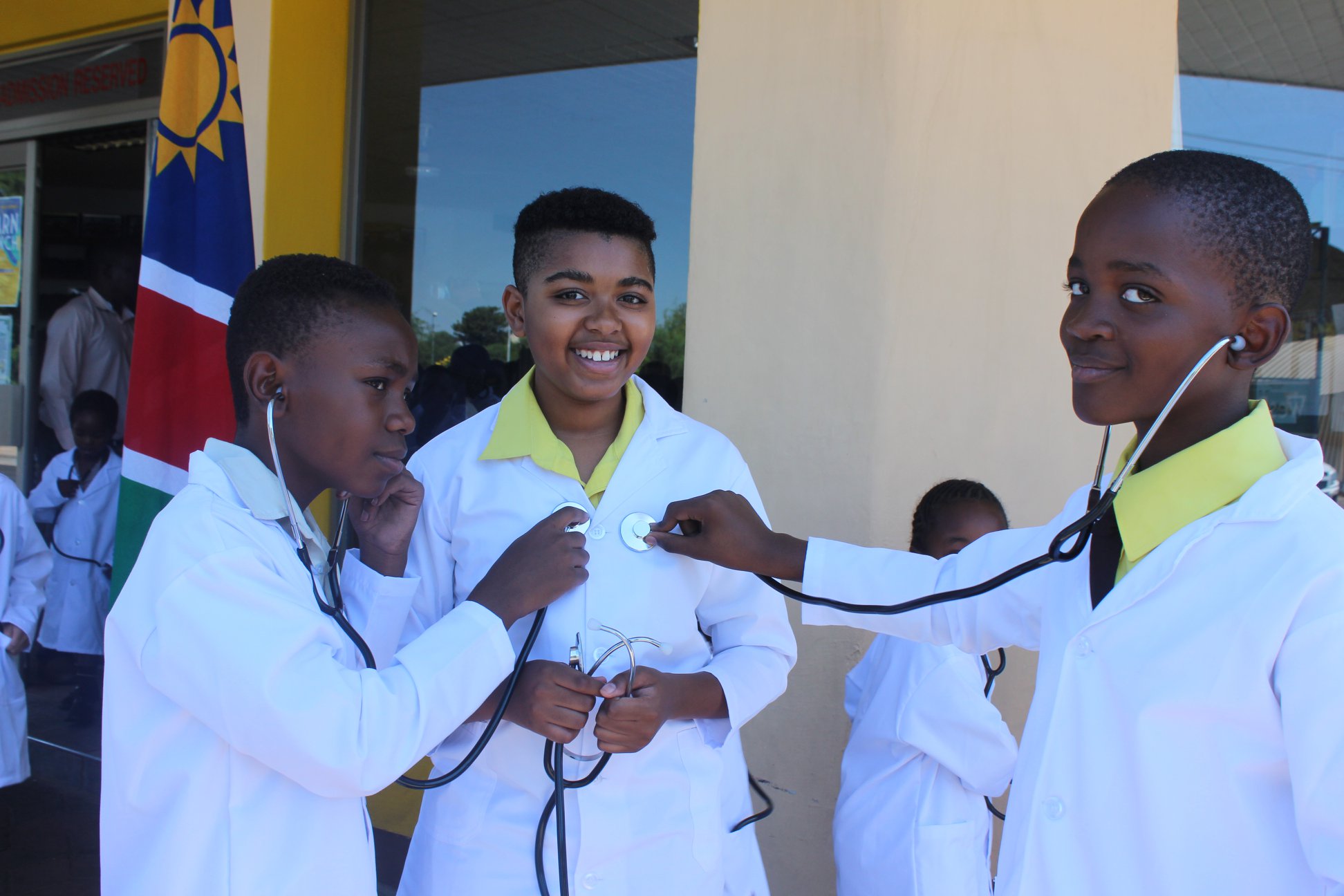 Learners role-playing a medical examination with a stethoscope